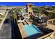 Resort-style pool area featuring water slides and a tower for endless fun under the sun at 6616 S Bridal Vail Dr, Gilbert, AZ 85298