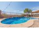 Inviting kidney-shaped pool with a relaxing patio area at 6616 S Bridal Vail Dr, Gilbert, AZ 85298