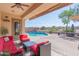 Relaxing backyard with pool and patio furniture at 6616 S Bridal Vail Dr, Gilbert, AZ 85298