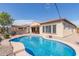 Large kidney shaped pool and spacious backyard at 6616 S Bridal Vail Dr, Gilbert, AZ 85298