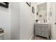 Small powder room with gray vanity and tile floor at 6616 S Bridal Vail Dr, Gilbert, AZ 85298