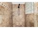 Large tiled shower with built-in shelves at 6616 S Bridal Vail Dr, Gilbert, AZ 85298