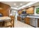 Well-equipped kitchen with granite countertops and wooden cabinetry at 7354 E San Miguel Ave, Scottsdale, AZ 85250