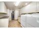 Bright laundry room with washer, dryer, and built-in storage at 7354 E San Miguel Ave, Scottsdale, AZ 85250