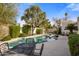 Inviting kidney-shaped pool with patio furniture and lush landscaping at 7354 E San Miguel Ave, Scottsdale, AZ 85250