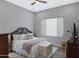 Spacious bedroom with a king-size bed and large window at 7483 S Loback Ct, Queen Creek, AZ 85142