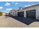 Three-car garage and paver driveway at 7483 S Loback Ct, Queen Creek, AZ 85142