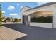 Attached garage with modern design and landscaping at 7483 S Loback Ct, Queen Creek, AZ 85142