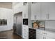 Kitchen features stainless steel appliances and white cabinetry at 7483 S Loback Ct, Queen Creek, AZ 85142