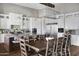 Open concept kitchen with large island and white cabinets at 7483 S Loback Ct, Queen Creek, AZ 85142