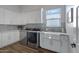 Bright laundry room with white cabinets and modern appliances at 7483 S Loback Ct, Queen Creek, AZ 85142