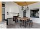 Rustic outdoor kitchen with a wood table and metal stools at 7483 S Loback Ct, Queen Creek, AZ 85142