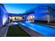 Night view of a luxurious pool with lounge chairs at 7483 S Loback Ct, Queen Creek, AZ 85142