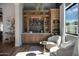 Home wet bar with ample storage and a stylish design at 7483 S Loback Ct, Queen Creek, AZ 85142