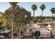 Aerial view of house, palm trees, and neighborhood at 7500 E Mccormick Pkwy # 63, Scottsdale, AZ 85258