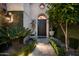 Elegant entry with ornate door, lush landscaping, and stone pathway at 7500 E Mccormick Pkwy # 63, Scottsdale, AZ 85258