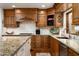 Bright kitchen with granite countertops and custom cabinetry at 7500 E Mccormick Pkwy # 63, Scottsdale, AZ 85258