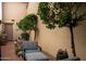 Small side patio with seating and potted plants at 7500 E Mccormick Pkwy # 63, Scottsdale, AZ 85258