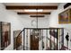 Elegant spiral staircase with wrought iron railing and art on the walls at 7500 E Mccormick Pkwy # 63, Scottsdale, AZ 85258