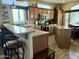 Open kitchen with a large island and breakfast bar at 7750 E Broadway Rd # 175, Mesa, AZ 85208