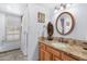 Charming bathroom with a single sink vanity, a shower, and a window at 7756 E San Miguel Ave, Scottsdale, AZ 85250