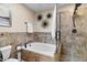 Spa-like bathroom featuring a large soaking tub and a walk-in shower at 7756 E San Miguel Ave, Scottsdale, AZ 85250