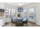 Kitchen breakfast nook with glass-top table and four chairs at 7756 E San Miguel Ave, Scottsdale, AZ 85250