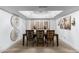 Formal dining room with chandelier and large artwork at 7756 E San Miguel Ave, Scottsdale, AZ 85250