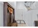 Bright entryway with wooden bench, hat rack and tile flooring at 7756 E San Miguel Ave, Scottsdale, AZ 85250