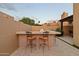 Outdoor bar with seating in a backyard setting at 7756 E San Miguel Ave, Scottsdale, AZ 85250