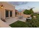 Private patio with seating area, artificial turf, and umbrella at 7756 E San Miguel Ave, Scottsdale, AZ 85250