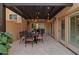 Covered patio with outdoor dining table and chairs at 7756 E San Miguel Ave, Scottsdale, AZ 85250