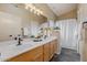 Double vanity bathroom with updated fixtures and shower at 8429 W Salter Dr, Peoria, AZ 85382