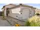 Front view of charming home with two-car garage and landscaping at 8429 W Salter Dr, Peoria, AZ 85382