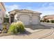 Front view of home with two-car garage and landscaped walkway at 8429 W Salter Dr, Peoria, AZ 85382