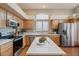 Modern kitchen with stainless steel appliances and island at 8429 W Salter Dr, Peoria, AZ 85382