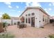 Private backyard patio with seating area and brick pavers at 8429 W Salter Dr, Peoria, AZ 85382