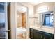 Bathroom with dark vanity and tan tile flooring at 850 S River Dr # 1066, Tempe, AZ 85281