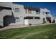 Building exterior featuring Spanish-style architecture and landscaping at 850 S River Dr # 1066, Tempe, AZ 85281