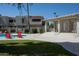 Relaxing pool area with red lounge chairs and covered patio at 850 S River Dr # 1066, Tempe, AZ 85281