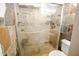 Walk-in shower with tile surround and glass enclosure at 850 S River Dr # 1066, Tempe, AZ 85281