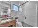 Modern bathroom with a large walk-in shower and granite vanity at 8912 W Roberta Ln, Peoria, AZ 85383