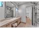 Modern bathroom with a floating vanity, large mirror, and walk-in shower at 8912 W Roberta Ln, Peoria, AZ 85383