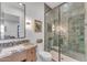 Modern bathroom with a large walk-in shower and granite countertops at 8912 W Roberta Ln, Peoria, AZ 85383