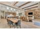 Open dining room with a live-edge table and modern chairs near the kitchen and living room at 8912 W Roberta Ln, Peoria, AZ 85383