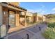 Front porch with seating area and desert landscaping at 8912 W Roberta Ln, Peoria, AZ 85383