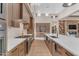 Modern kitchen features stainless steel appliances and white cabinets at 8912 W Roberta Ln, Peoria, AZ 85383