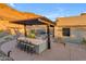 Covered outdoor bar with seating for multiple guests at 8912 W Roberta Ln, Peoria, AZ 85383