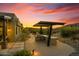 Modern outdoor kitchen with pergola and grill at 8912 W Roberta Ln, Peoria, AZ 85383