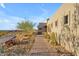 Landscaped walkway leading to the entrance of the home at 8912 W Roberta Ln, Peoria, AZ 85383